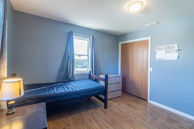 819 E Main St, West Union, OH 45693 - bedroom featuring wood finished floors and baseboards