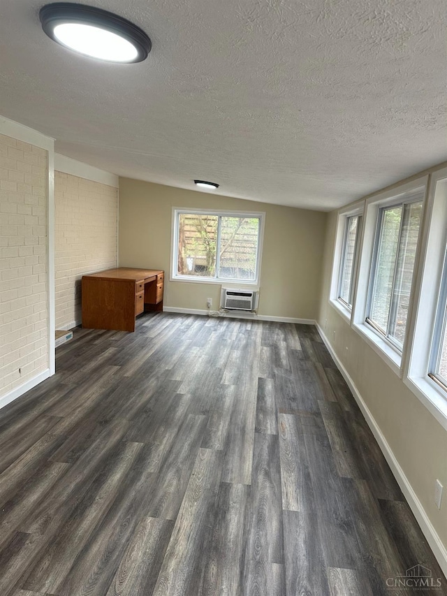 41 Wolfer Dr, Batavia Twp, OH 45102 - empty room with plenty of natural light, dark wood-type flooring, and a textured ceiling