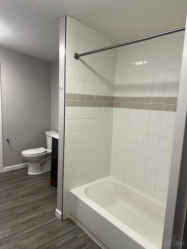 41 Wolfer Dr, Batavia Twp, OH 45102 - bathroom with toilet, bathing tub / shower combination, wood finished floors, and baseboards