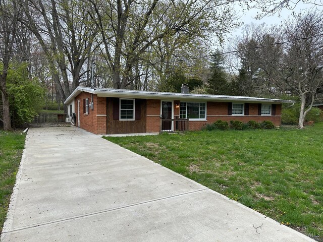 41 Wolfer Dr, Batavia Twp, OH 45102 - ranch-style home with concrete driveway, a front lawn, and brick siding