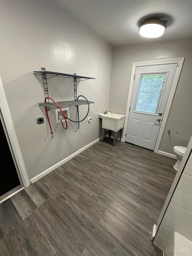 41 Wolfer Dr, Batavia Twp, OH 45102 - clothes washing area featuring baseboards, washer hookup, and dark wood finished floors