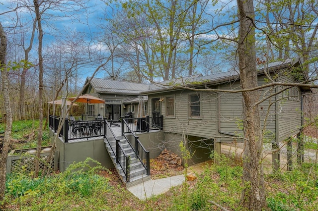 exterior space featuring a deck and stairs
