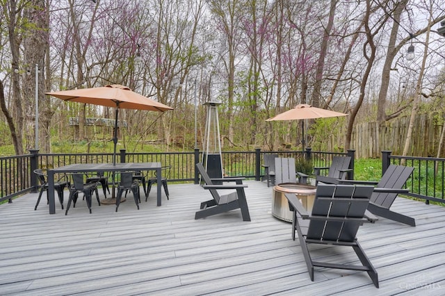 wooden deck featuring outdoor dining space
