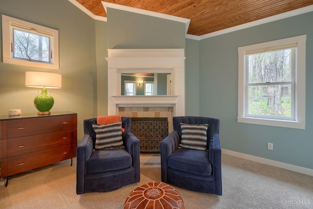 living area with wood ceiling, baseboards, ornamental molding, light carpet, and a fireplace