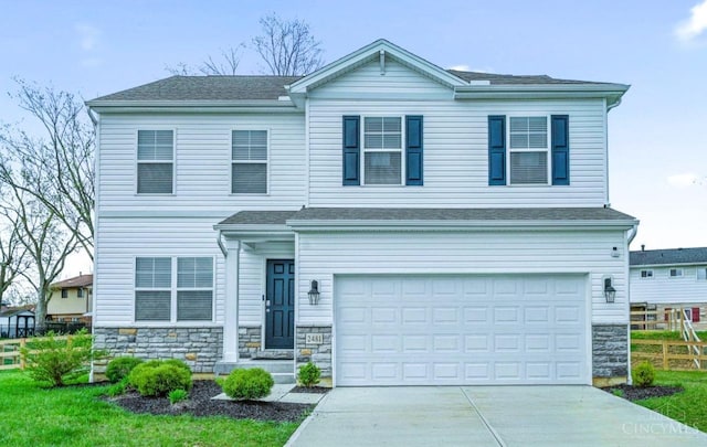 2481 Crosley Mdw, Colerain Twp, OH 45239 - traditional-style home featuring driveway, a garage, and stone siding