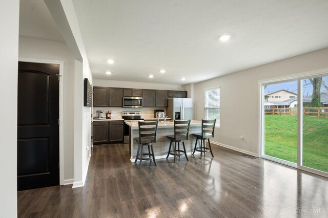 2481 Crosley Mdw, Colerain Twp, OH 45239 - kitchen featuring recessed lighting, baseboards, dark wood-style floors, and stainless steel appliances