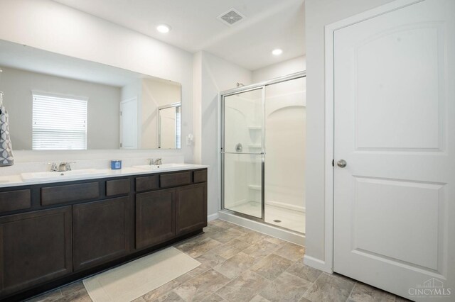 2481 Crosley Mdw, Colerain Twp, OH 45239 - bathroom featuring a shower stall, double vanity, a sink, and visible vents