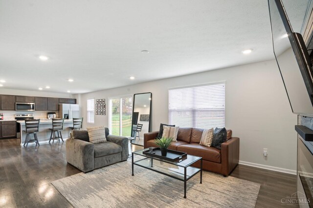 2481 Crosley Mdw, Colerain Twp, OH 45239 - living area featuring recessed lighting, dark wood-type flooring, and baseboards