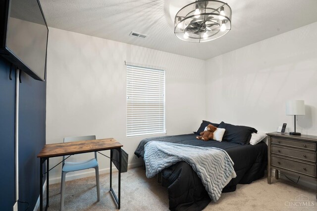 2481 Crosley Mdw, Colerain Twp, OH 45239 - bedroom featuring a chandelier, light colored carpet, and visible vents