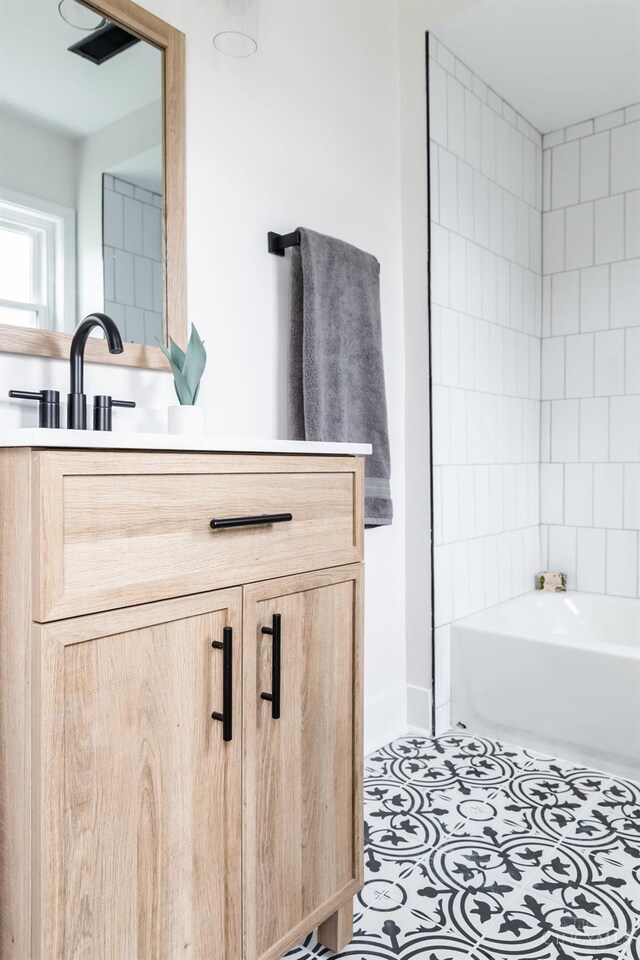 11475 Colthar Rd, Clark Twp, OH 45106 - bathroom with baseboards, a bathtub, and vanity