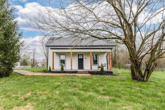 11475 Colthar Rd, Clark Twp, OH 45106 - view of front facade featuring roof with shingles, a front lawn, and covered porch