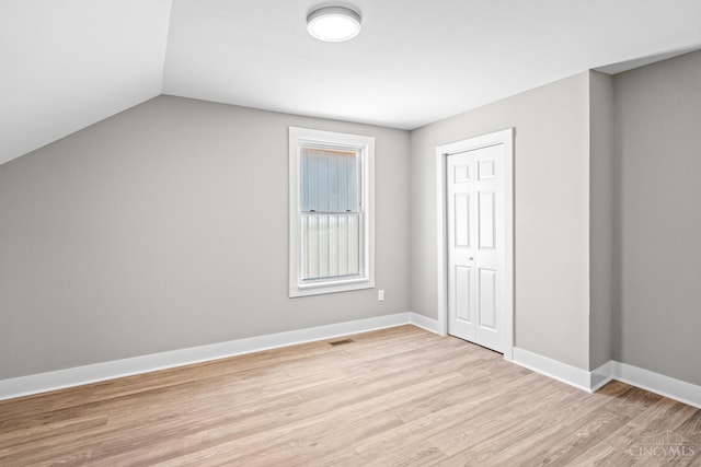 1318 Knowlton St, Cincinnati, OH 45223 - additional living space featuring light wood-style floors, lofted ceiling, visible vents, and baseboards