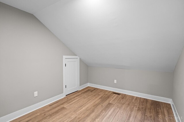 1318 Knowlton St, Cincinnati, OH 45223 - bonus room featuring vaulted ceiling, light wood-style floors, and baseboards