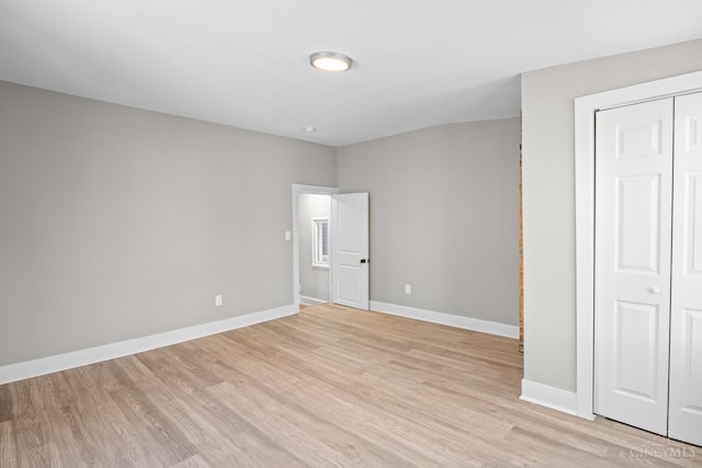 1318 Knowlton St, Cincinnati, OH 45223 - unfurnished bedroom featuring light wood-style floors, a closet, and baseboards