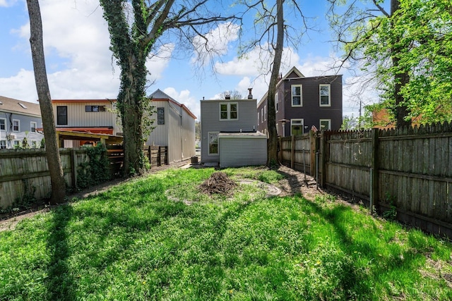 1318 Knowlton St, Cincinnati, OH 45223 - view of yard with a fenced backyard, an outbuilding, and a storage unit