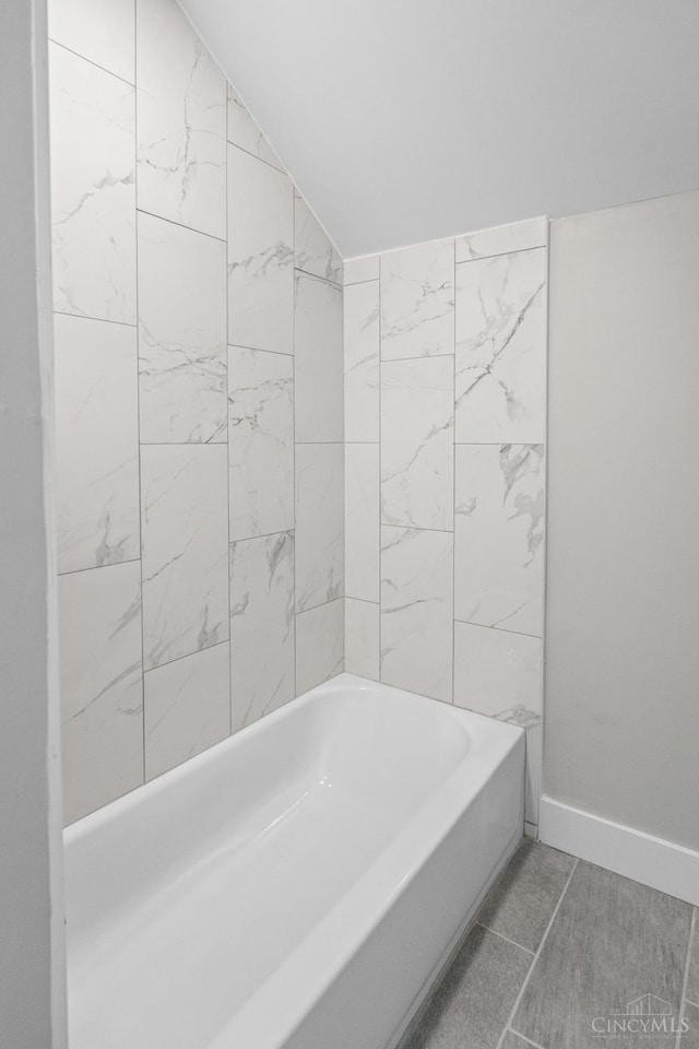 1318 Knowlton St, Cincinnati, OH 45223 - full bathroom with lofted ceiling, baseboards, and a tub