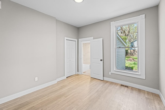 1318 Knowlton St, Cincinnati, OH 45223 - unfurnished bedroom featuring baseboards, light wood finished floors, and visible vents