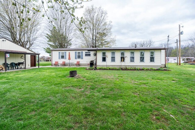 6651 Wizard Of Oz Way, Paint Twp, OH 45133 - view of front facade featuring a patio and a front lawn