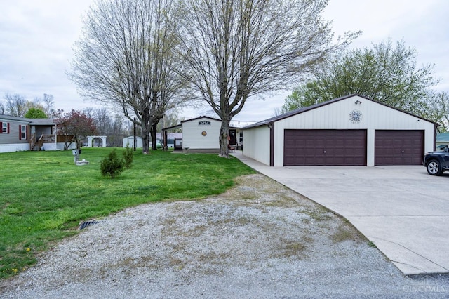 6651 Wizard Of Oz Way, Paint Twp, OH 45133 - view of property exterior featuring a detached garage and a lawn