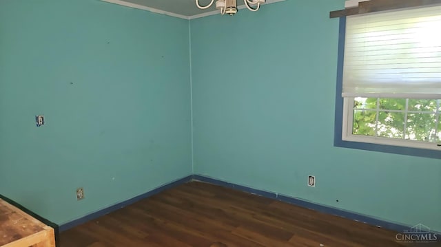 1847 Carnes Rd, Monroe Twp, OH 45157 - spare room with dark wood-type flooring and a chandelier