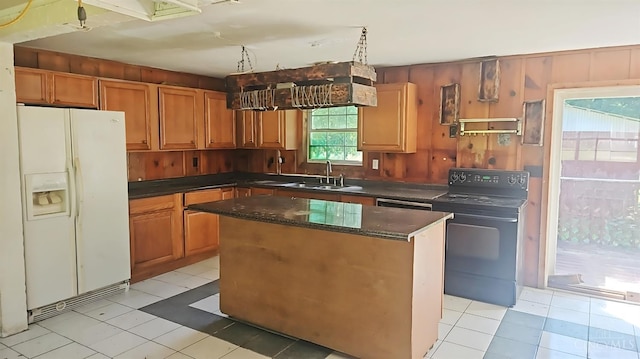 1847 Carnes Rd, Monroe Twp, OH 45157 - kitchen with white fridge with ice dispenser, dark countertops, a kitchen island, electric range, and light tile patterned floors