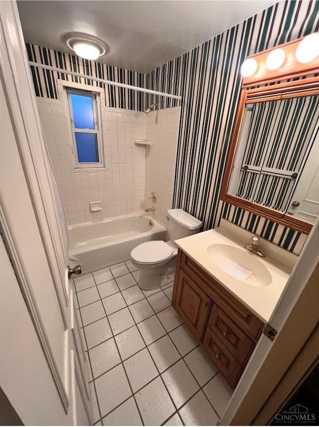 full bath featuring toilet, shower / tub combination, wallpapered walls, tile patterned flooring, and vanity