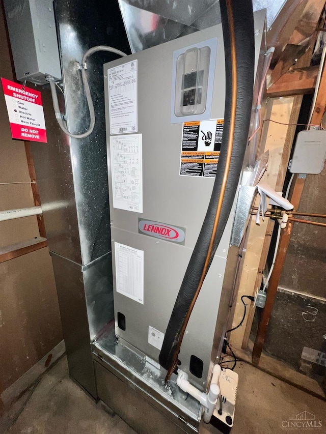 utility room with heating unit
