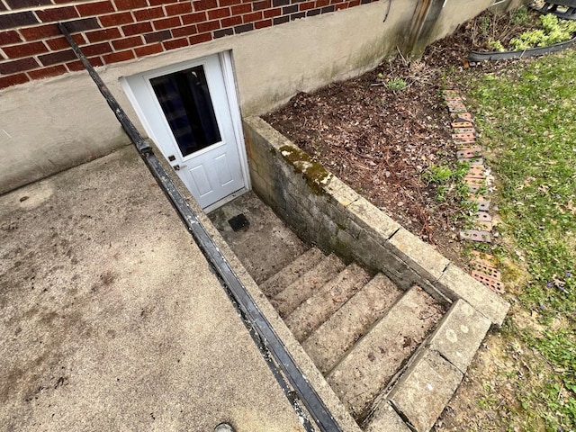 exterior space with brick siding