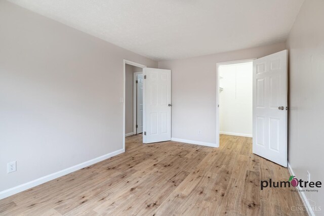 3640 Westwood Northern Blvd Unit 24, Cheviot, OH 45211 - unfurnished bedroom with wood finished floors and baseboards