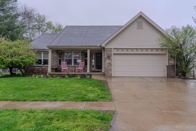 10701 Stone Ridge Way, Harrison, OH 45030 - ranch-style house with brick siding, driveway, a porch, and a front lawn