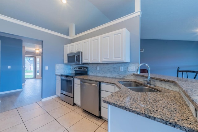 10701 Stone Ridge Way, Harrison, OH 45030 - kitchen featuring dark stone countertops, a sink, white cabinets, backsplash, and appliances with stainless steel finishes