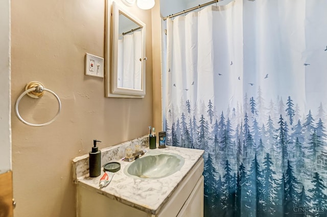 bathroom with vanity and a shower with shower curtain
