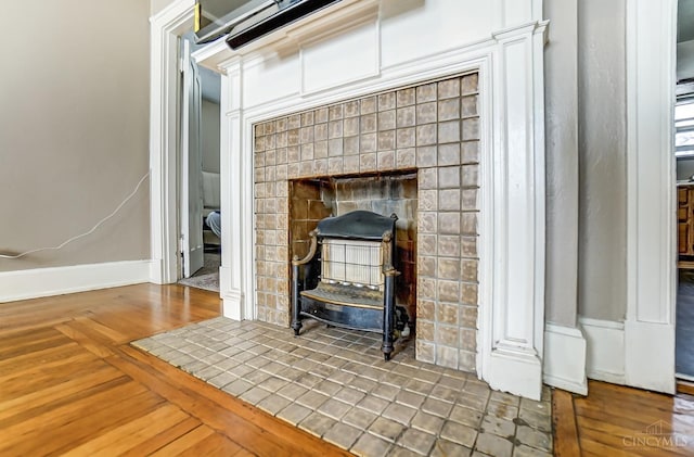 interior details featuring baseboards and wood finished floors
