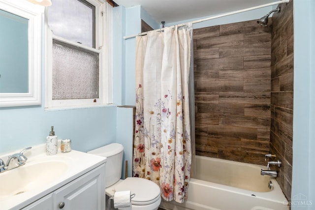 full bath with vanity, shower / bathtub combination with curtain, and toilet