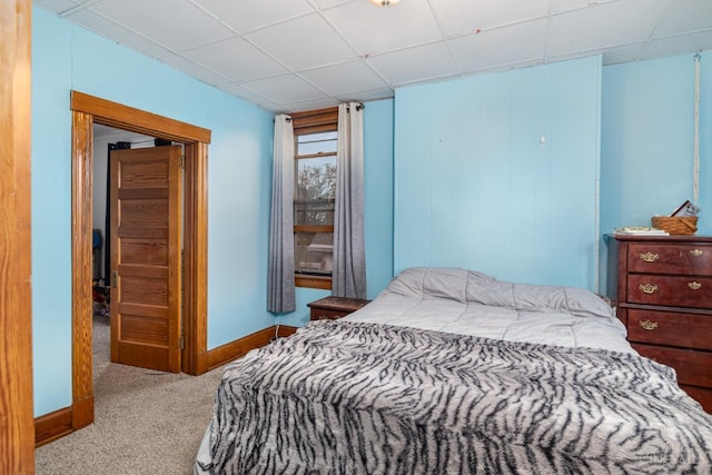 bedroom with carpet and a drop ceiling