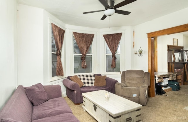 living room with light colored carpet and ceiling fan