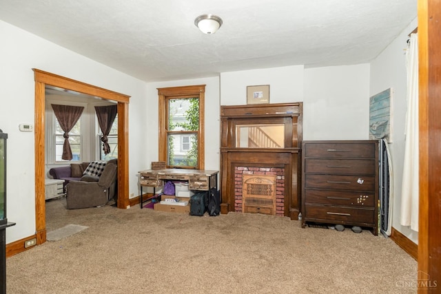 interior space with baseboards and carpet flooring