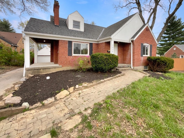 7046 Beechmont Ave, Anderson Twp, OH 45230 - view of front facade featuring brick siding, a chimney, a shingled roof, and covered porch