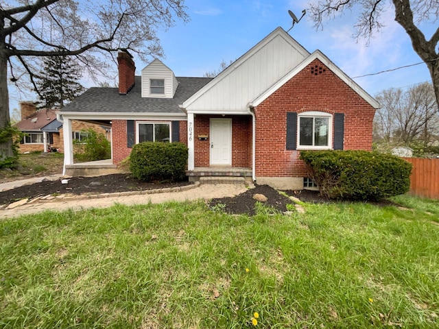 7046 Beechmont Ave, Anderson Twp, OH 45230 - view of front facade featuring brick siding, a chimney, and roof with shingles