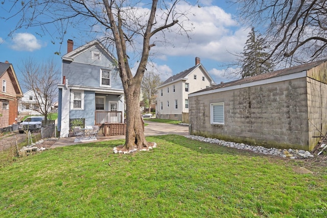 view of yard with a residential view and fence