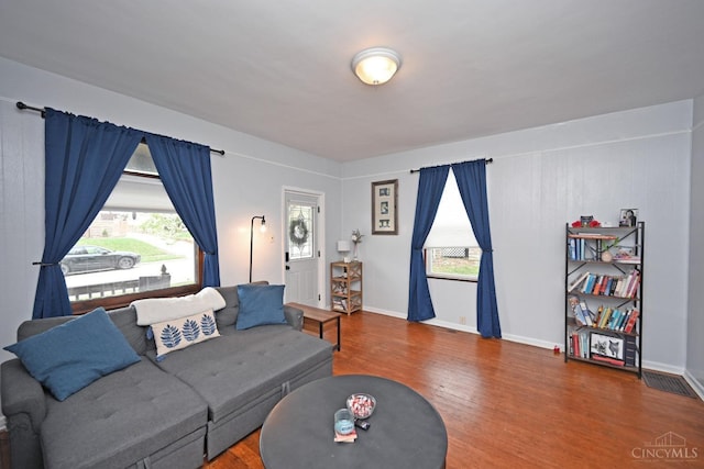 living area featuring wood finished floors and baseboards