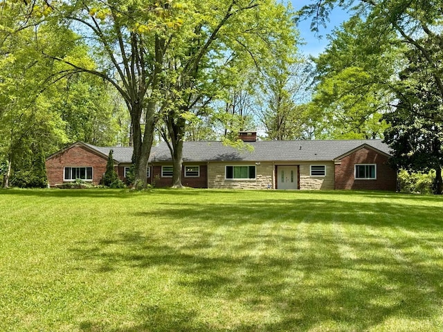 413 N Marshall Rd, Middletown, OH 45042 - ranch-style house featuring a front yard, a chimney, and stone siding