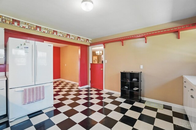413 N Marshall Rd, Middletown, OH 45042 - kitchen featuring freestanding refrigerator, tile patterned floors, baseboards, and arched walkways