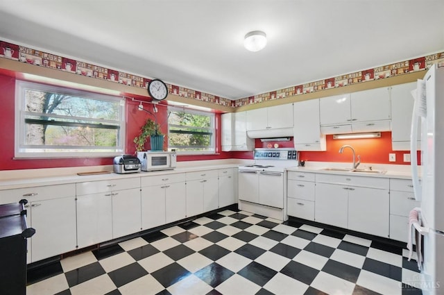 413 N Marshall Rd, Middletown, OH 45042 - kitchen featuring white appliances, a sink, light floors, and light countertops