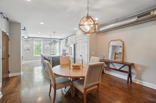 1308 Broadway St Unit 2, Cincinnati, OH 45202 - dining room featuring recessed lighting, baseboards, dark wood-type flooring, and a chandelier