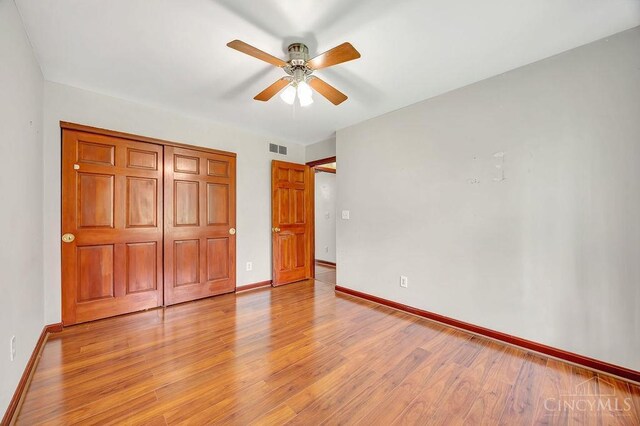 4092 Snowhill Rd, Perry Twp, OH 45118 - unfurnished bedroom with baseboards, visible vents, and light wood-type flooring