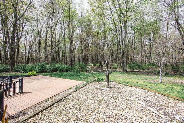 4092 Snowhill Rd, Perry Twp, OH 45118 - view of yard with a wooded view and a deck