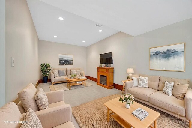 4092 Snowhill Rd, Perry Twp, OH 45118 - living room with recessed lighting, visible vents, baseboards, a glass covered fireplace, and light colored carpet