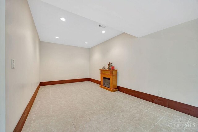 4092 Snowhill Rd, Perry Twp, OH 45118 - empty room with baseboards, a glass covered fireplace, visible vents, and recessed lighting