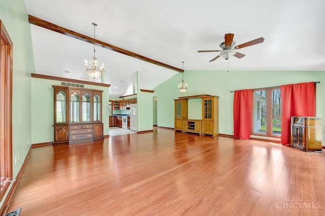 4092 Snowhill Rd, Perry Twp, OH 45118 - unfurnished living room featuring wood finished floors, visible vents, vaulted ceiling with beams, baseboards, and ceiling fan with notable chandelier